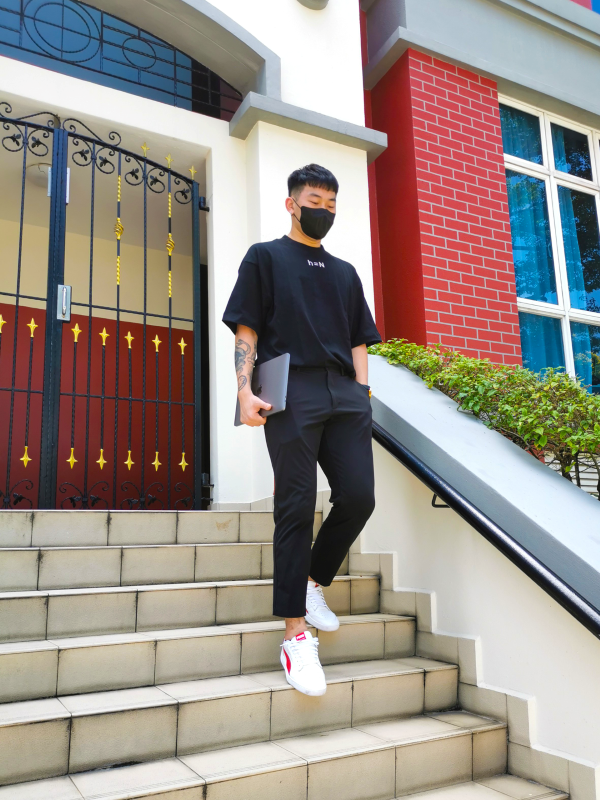 initial hypothesis male model carrying laptop off for work