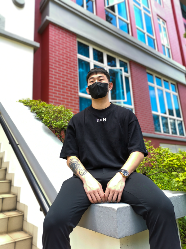 initial hypothesis male millennial model sitting on the ledge waiting for friends